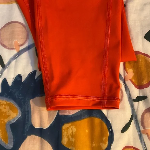 Athleta Orange leggings. Inside pocket for keys or money. Side zipper pockets. - Picture 2 of 5